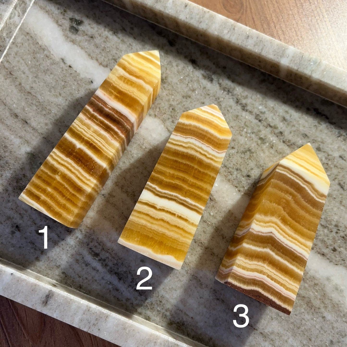 Obelischi in calcite arancione