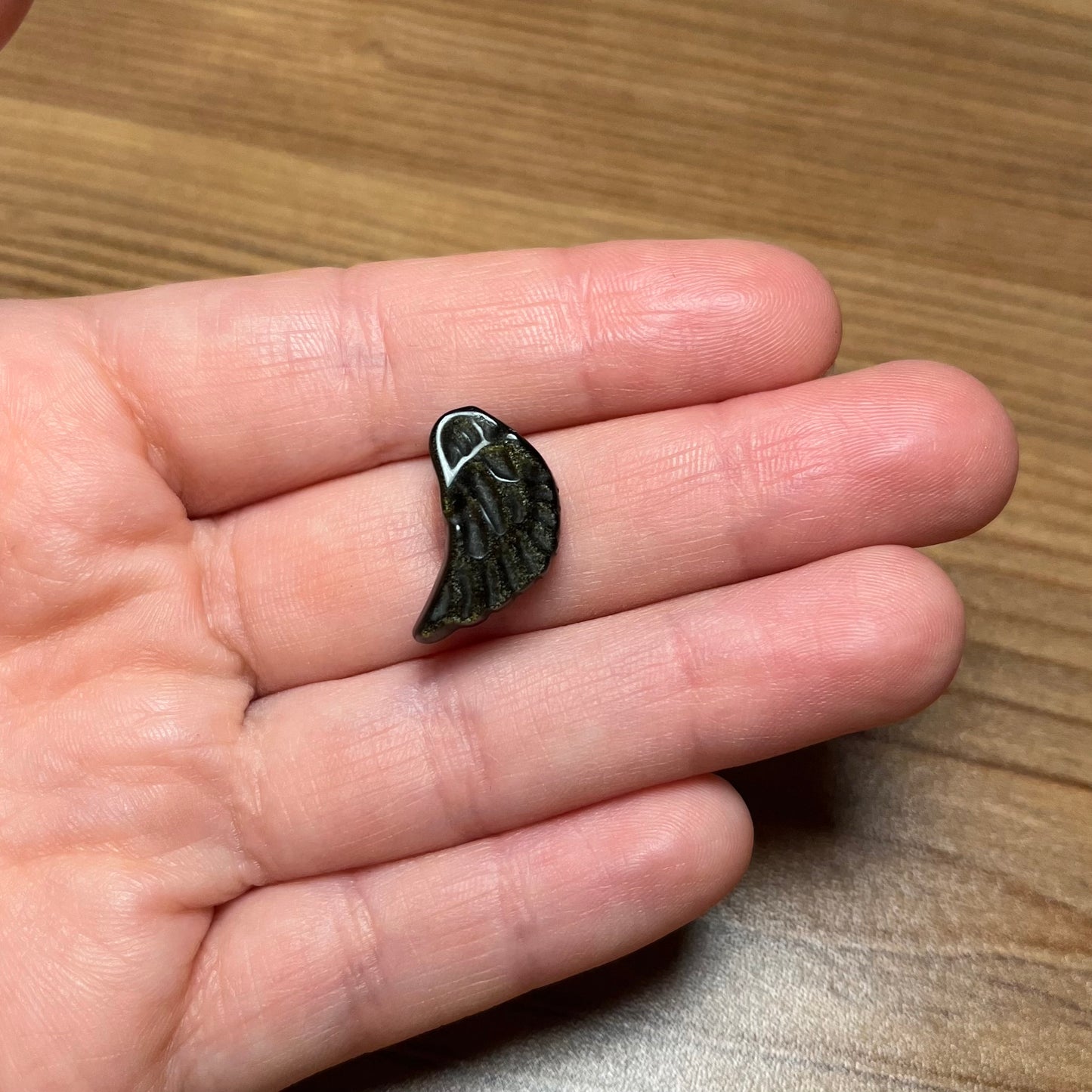 Ala in ossidiana dorata